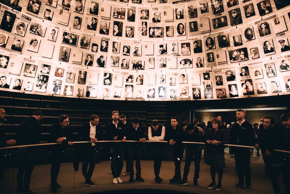 Israel Cycling Academy riders in the Hall of Names at Yad Vashem, the Holocaust Remembrance Authority in Jerusalem