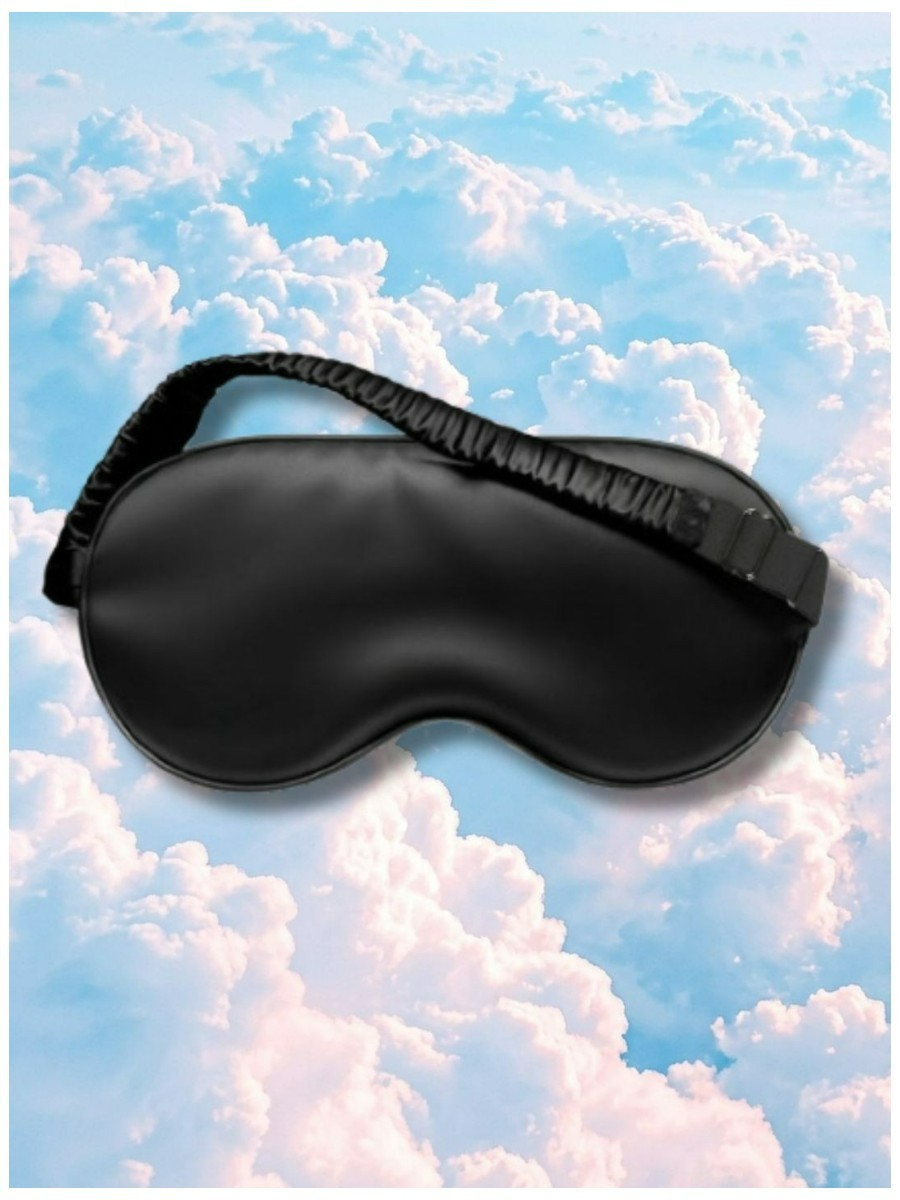 Mulberry silk eye mask on a dreamy pastel cloud background.