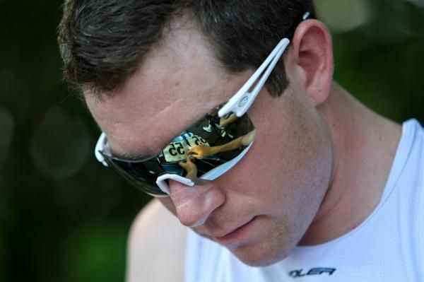 Morgan Schmitt (UnitedHealthcare) pins on his race number before the start.
