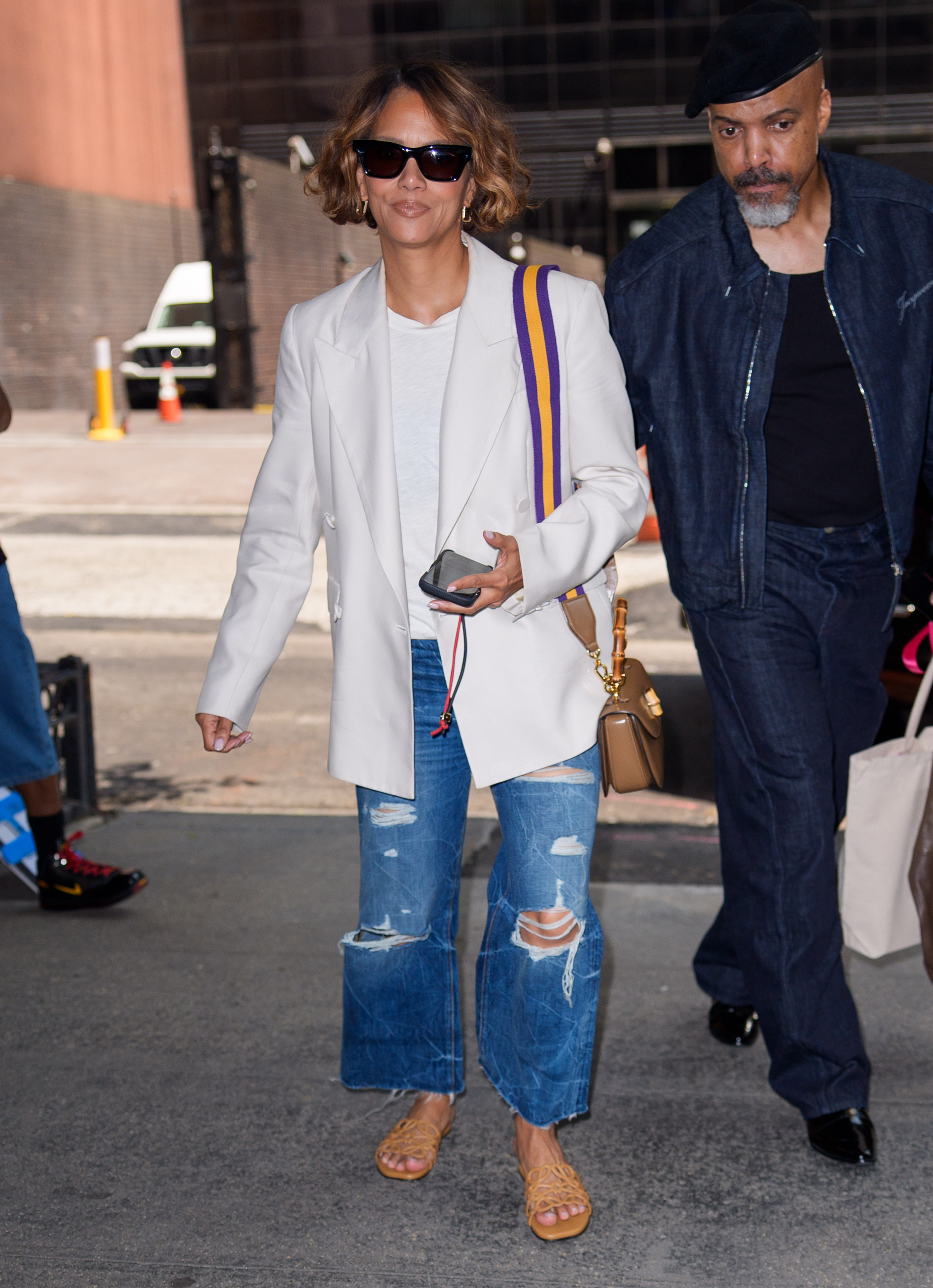 An image of Halle Berry wearing a white blazer, an example of a summer 2025 fashion trend for over 50s, while in New York.