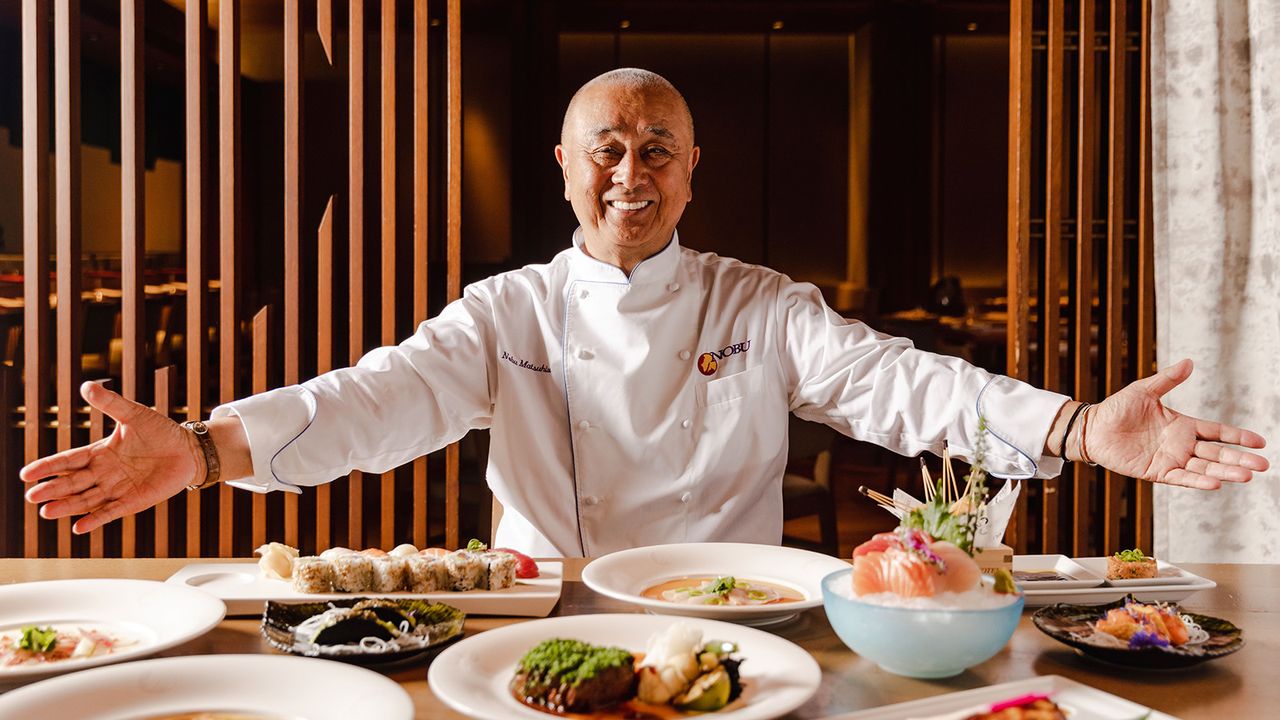 Chef Nobuyuki ‘Nobu’ Matsuhisa with open arms and array of food