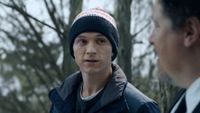 Peter wearing a hat talking to Happy at the end of No Way Home. 