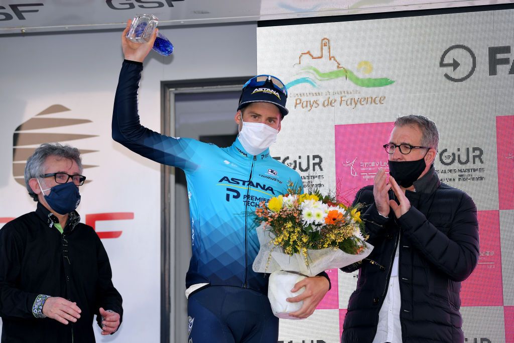 FAYENCE FRANCE FEBRUARY 20 Podium Hugo Houle of Canada and Team Astana Premier Tech Most Combative Rider celebrate during the 53rd Tour Des Alpes Maritimes Et Du Var Stage 2 a 1689km stage from Fayence to Fayence 357m Trophy Mask Covid safety measures Hostess Flowers letour0683 on February 20 2021 in Fayence France Photo by Luc ClaessenGetty Images