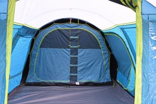 The living area of the Coleman Castle Pines 4L BlackOut Tent is really generous and features several windows, as well as a side door
