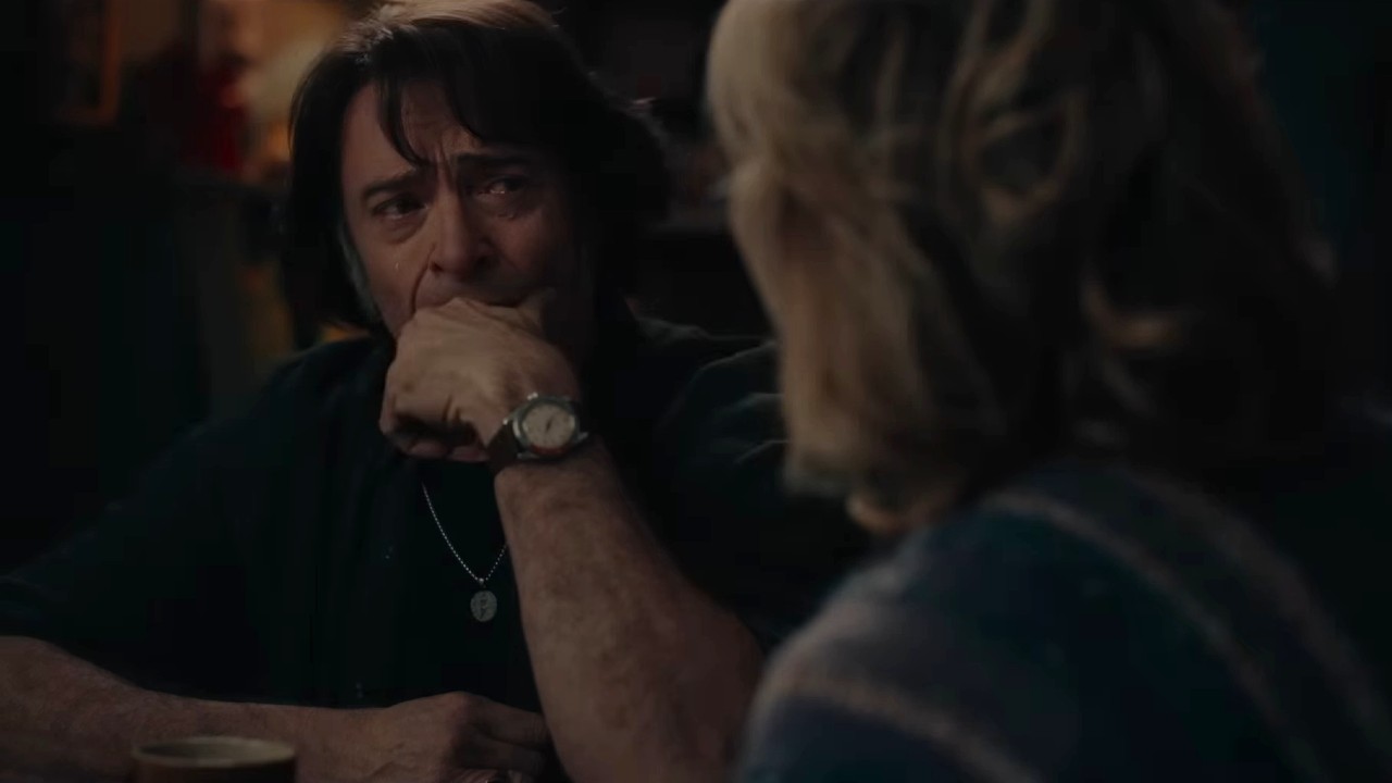 Hugh Jackman crying with Kate Hudson looking in Song Sung Blue.