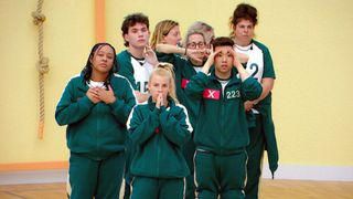 Some Squid Game players stand in shock