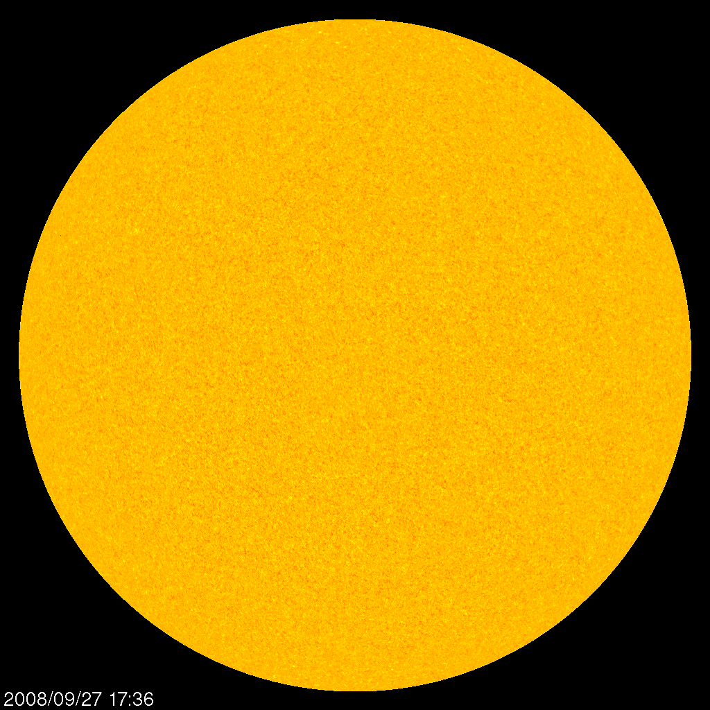 This visible-light photograph, taken in 2008 by NASA's Solar and Heliospheric Observatory (SOHO) spacecraft, shows the Sun's face free of sunspots. The Sun experienced 780 spotless days during the unusually long solar minimum that just ended. New computer simulations imply that the Sun's long quiet spell resulted from changing flows of hot plasma within it.