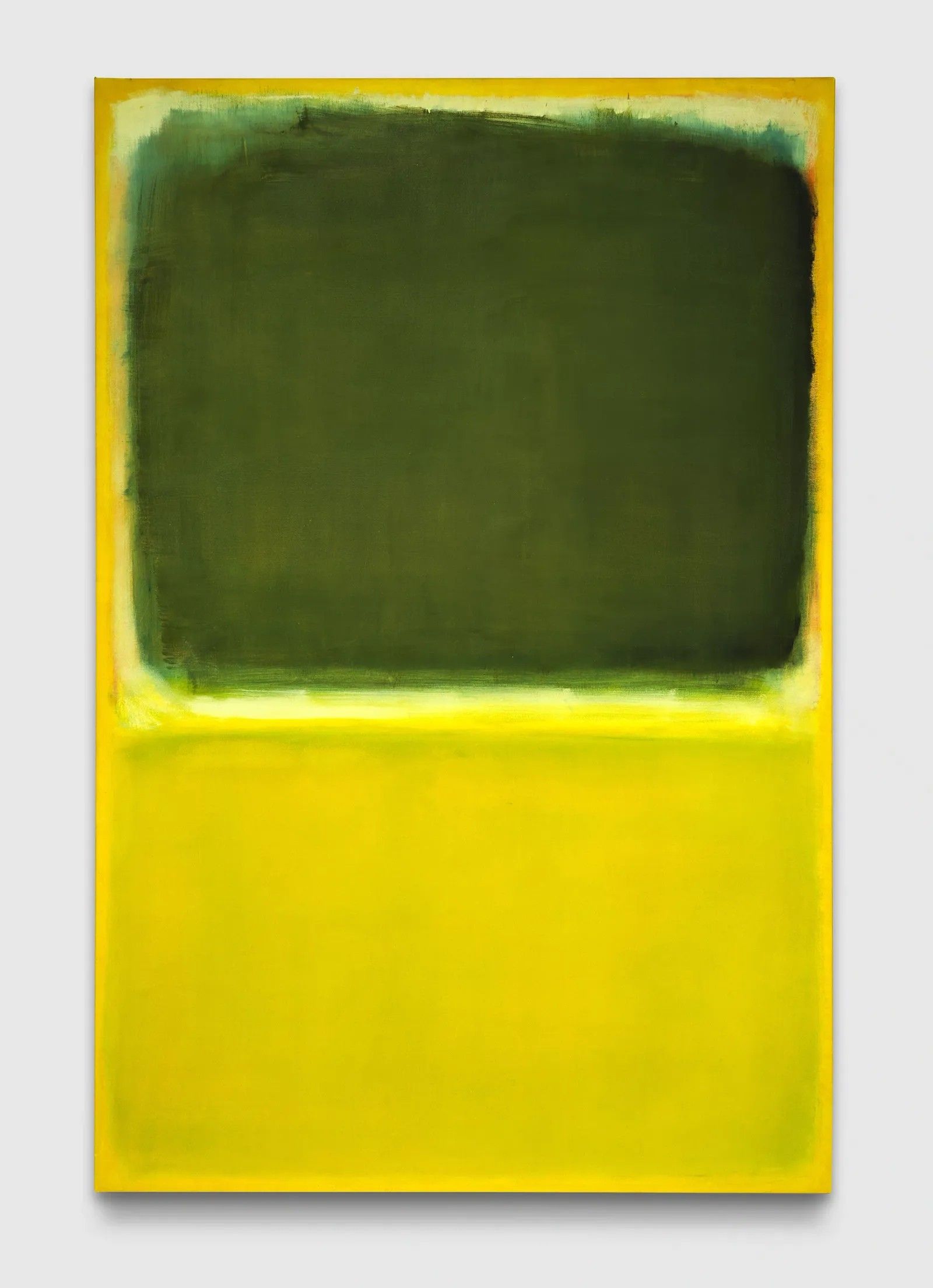 An abstract canvas made of swathes of green (top) and yellow.