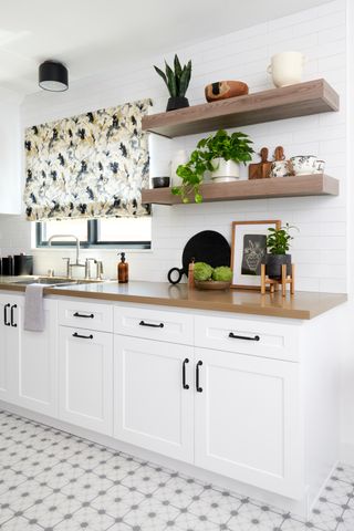 white kitchen with open shelving by LH. Designs
