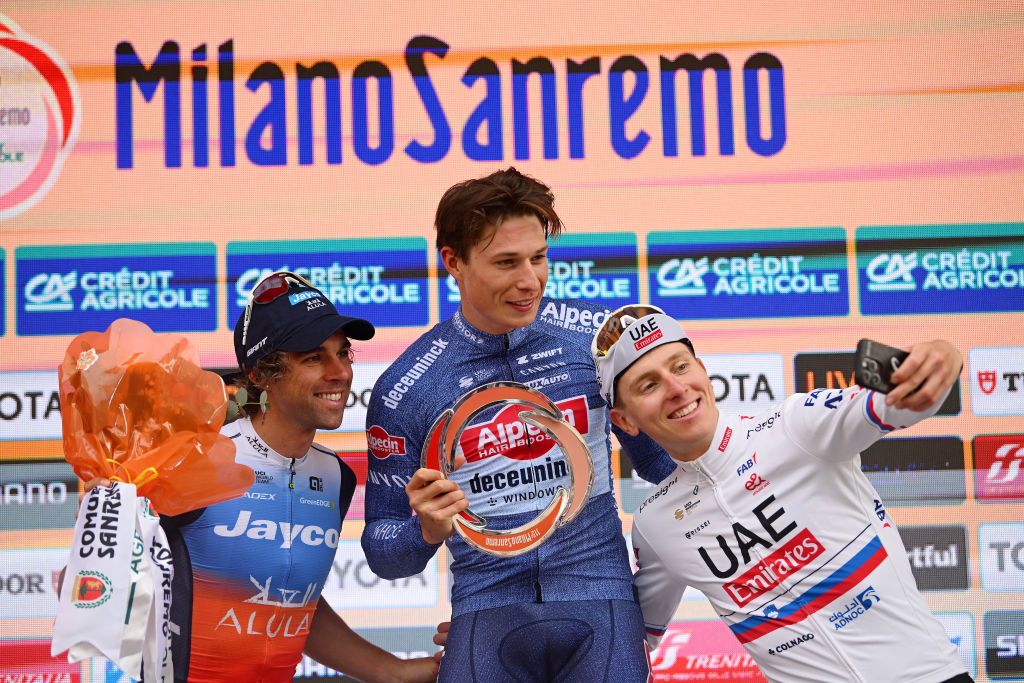 Jasper Philipsen, Michael Matthews, and Tadej Pogačar on the final podium of the 2024 Milan-San Remo