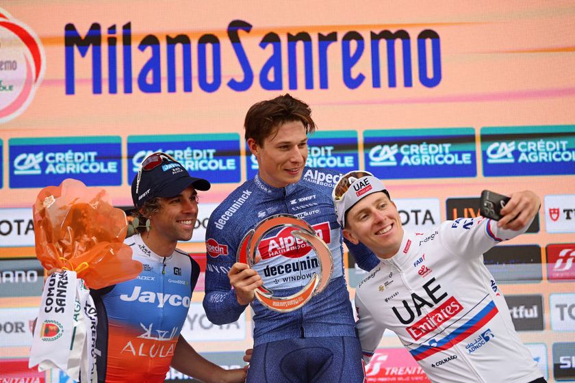 Jasper Philipsen, Michael Matthews, and Tadej Pogačar on the final podium of the 2024 Milan-San Remo