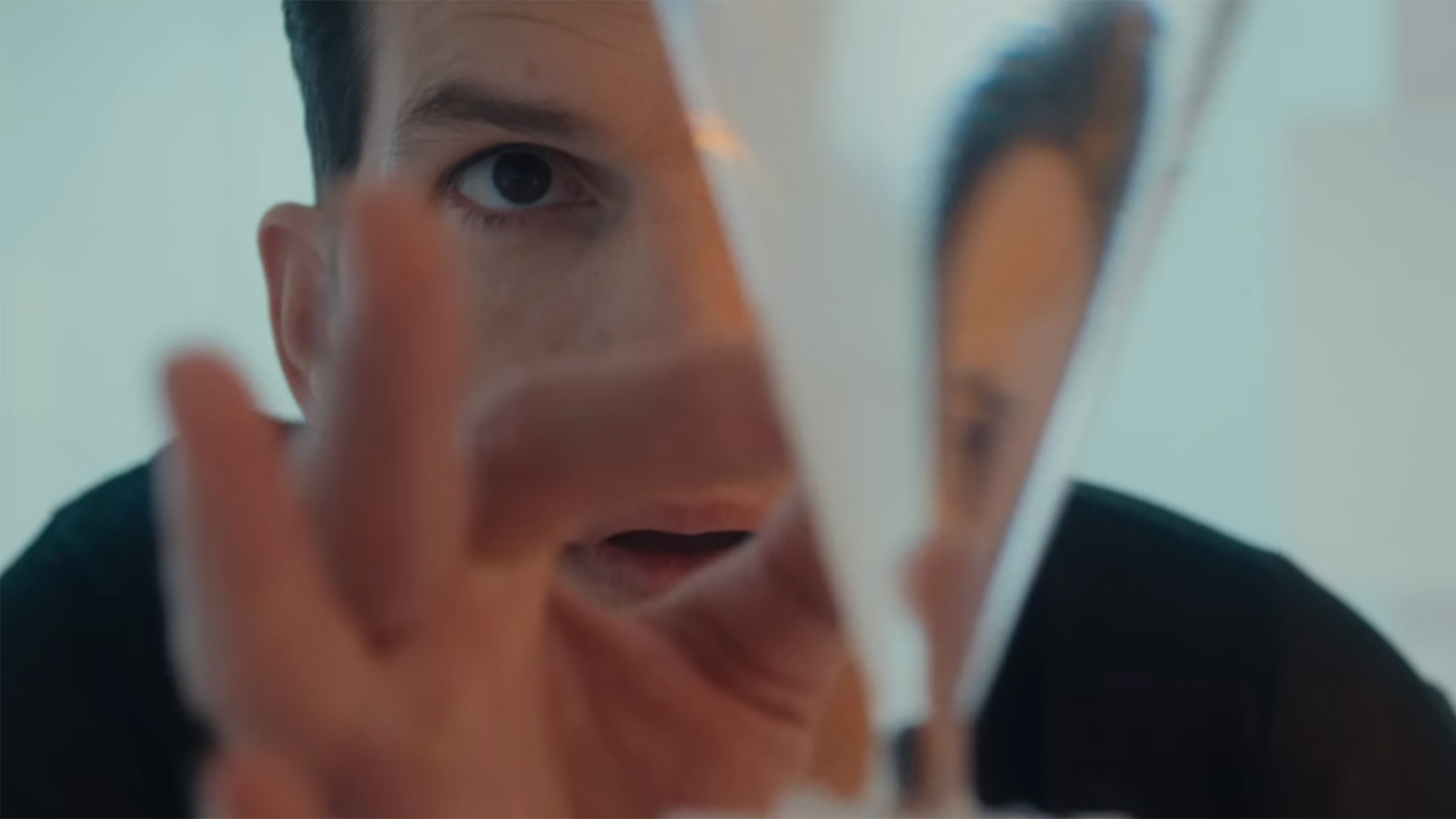 Ashton Kutcher touching a glass while looking at his reflection in FX's Beauty.