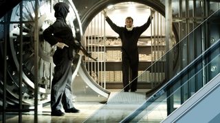 Dalton Russell stands in a bank's vault in 2006's Inside Man movie