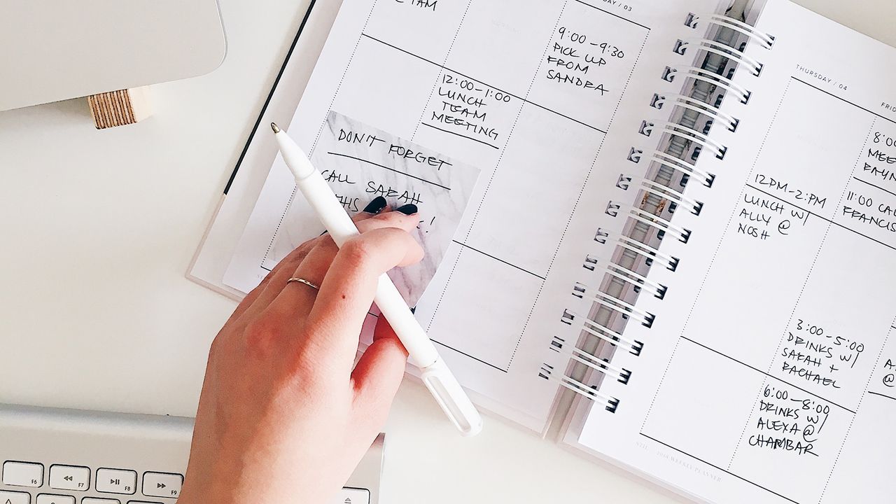 Person&#039;s hand on a calendar