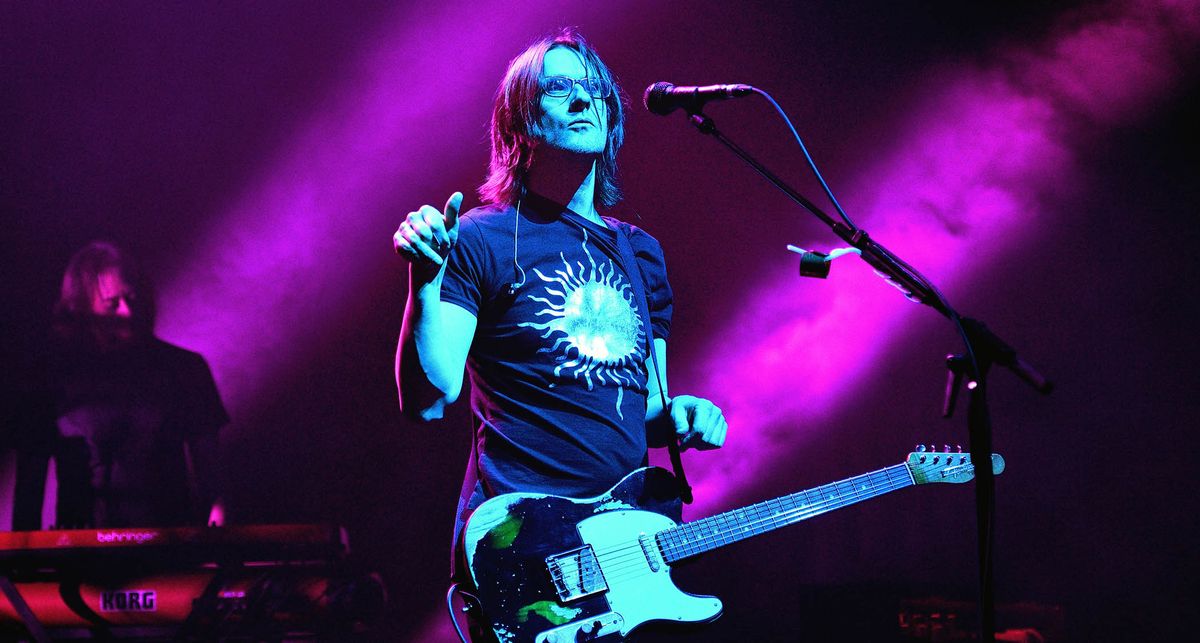 Steven Wilson performs at the Royal Albert Hall: on a stage lit in purple, he plays his Fender Telecaster.