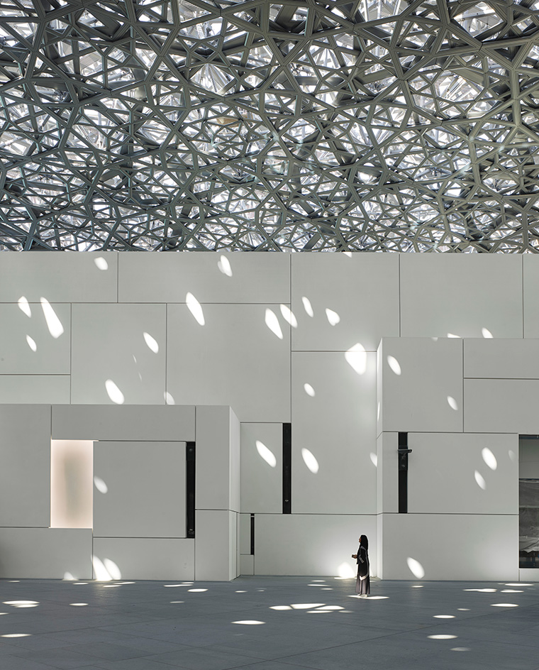 White building underneath layers of aluminium and stainless steel