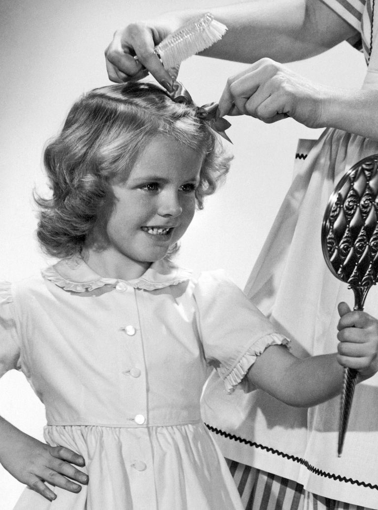 little girl doing hair