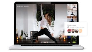 Woman in yoga pose shown on computer screen