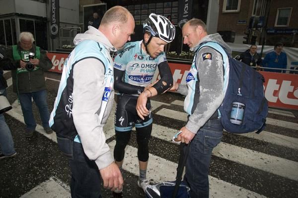 Matteo Trentin (Omega Pharma-Quickstep) assesses the damage post-crash