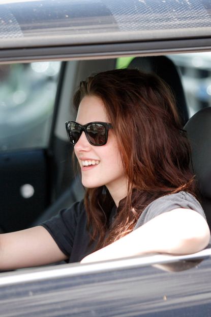 Kristen Stewart driving her blue pick-up truck