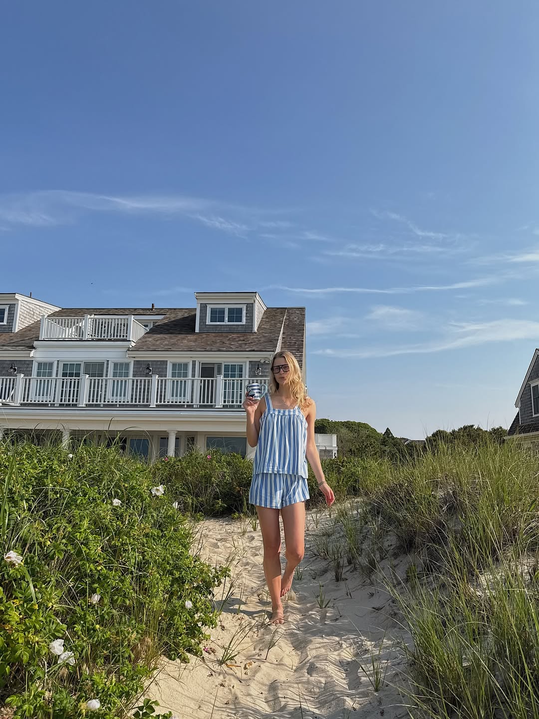 Lauren in a striped matching set by the beach
