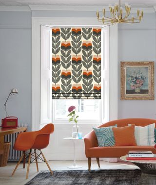 living room with white scheme and colourful orla kiely blinds