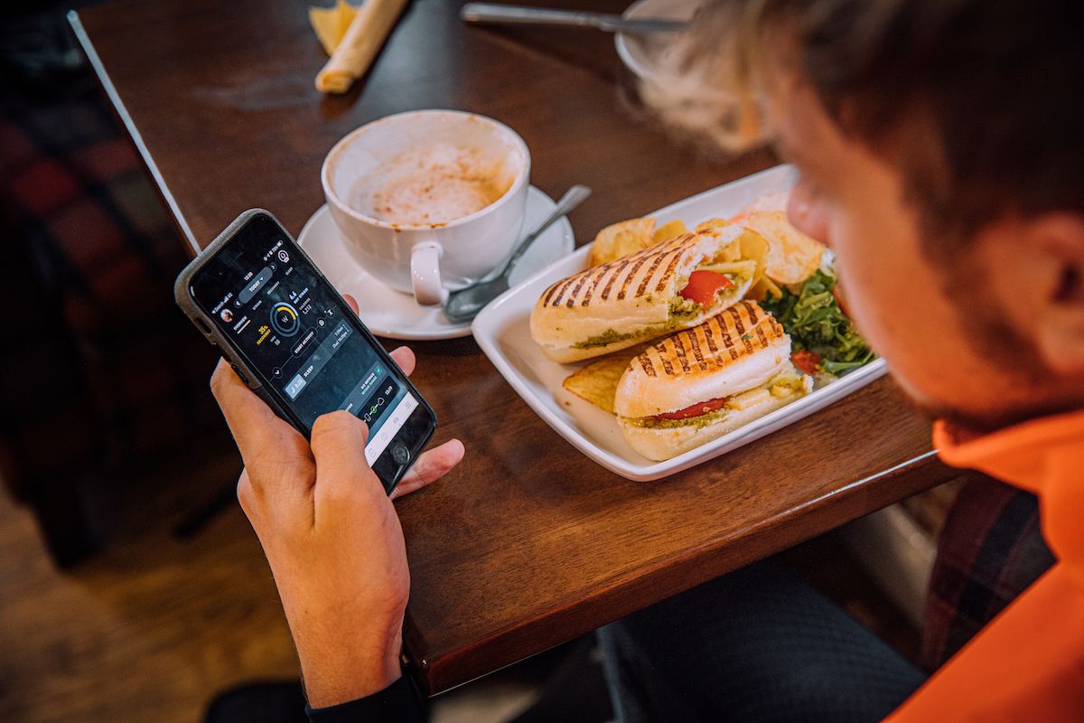 Image shows a rider taking a cafe stop during a winter training ride