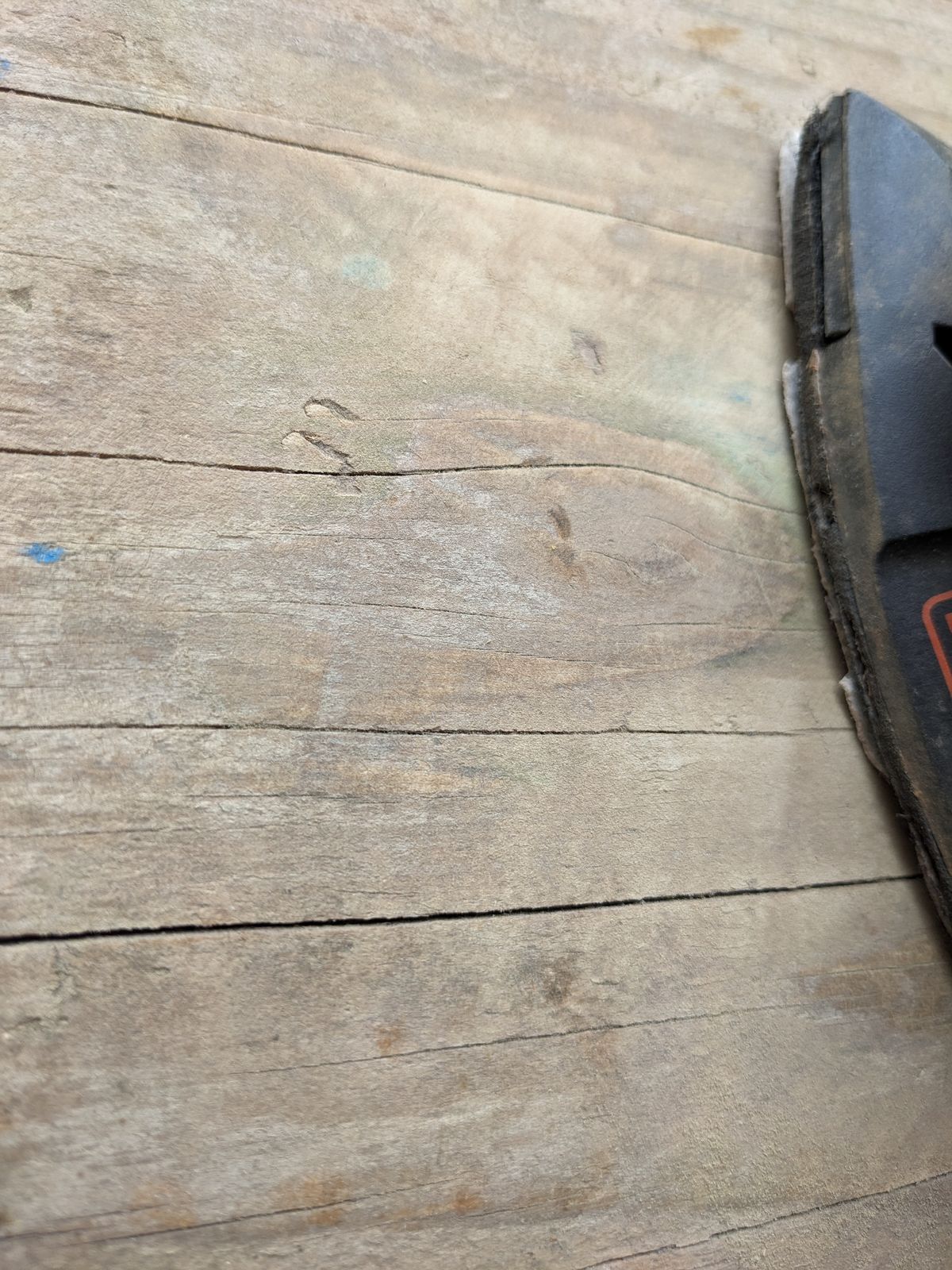 A close up of a wooden board that has just been sanded