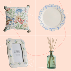 Primark cushion, plate, photo frame and diffuser on a pink background.