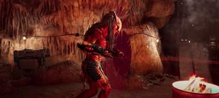 An alien warrior in a cave wields a wicked weapon