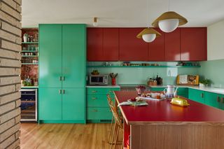 A green and red kitchen
