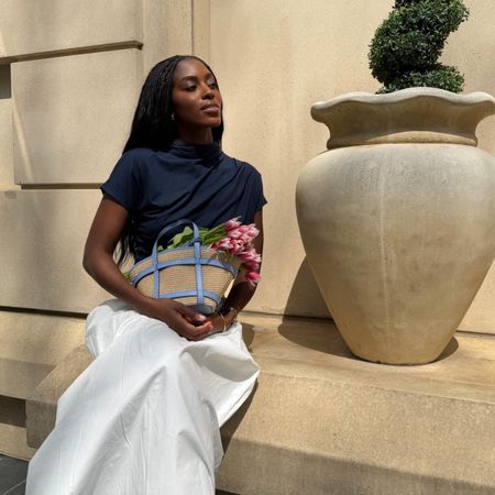 A woman outside during spring with flowers