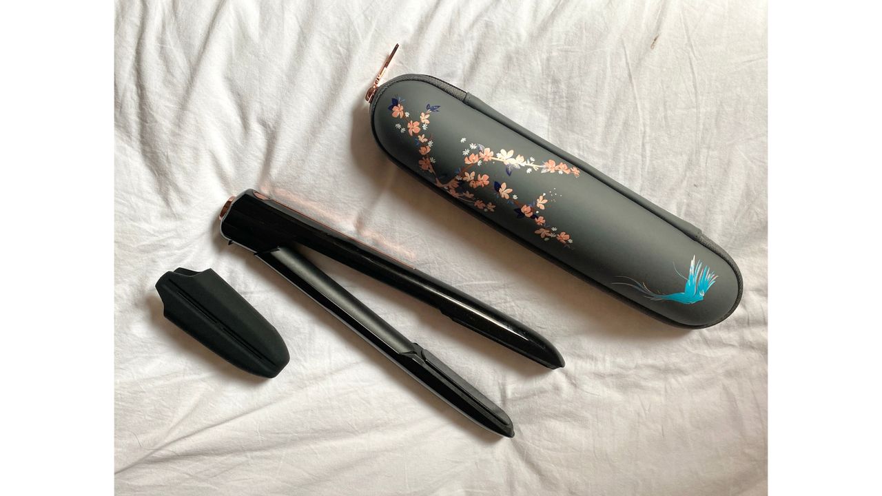 Original image showing flatlay of BaByliss Cordless Straightener with its case and guard