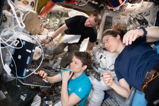 NASA astronauts Anne McClain, Christina Koch and Nick Hague prepare their EMU (Extravehicular Mobility Unit) suits for a series of spacewalks set to take place on March 22, March 29 and April 8.