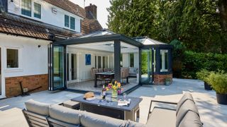 modern orangery style conservatory with anthracite aluminium frame and bi-fold doors
