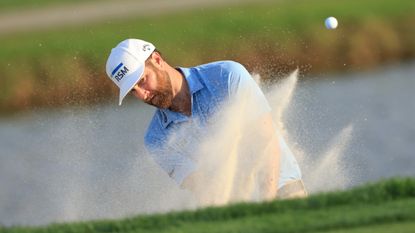 Chris Kirk plays a shot from a greenside bunker on the 17th hole at Bay Hill