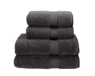 Christy Supreme Hygro® Towels in dark grey folded in a stack