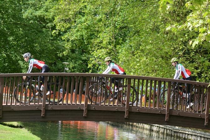 The Swiss team cross the New River in Cheshunt on their way to sign on