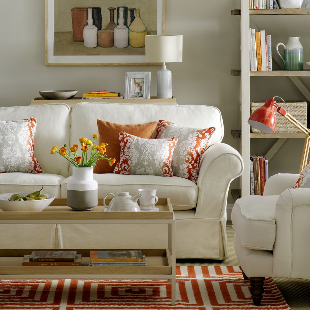 living room with pillows on white sofa