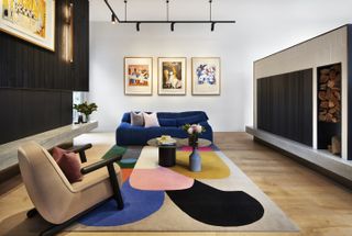 A Colorful living room Inspired by Alice in Wonderland Art with a colorful rug