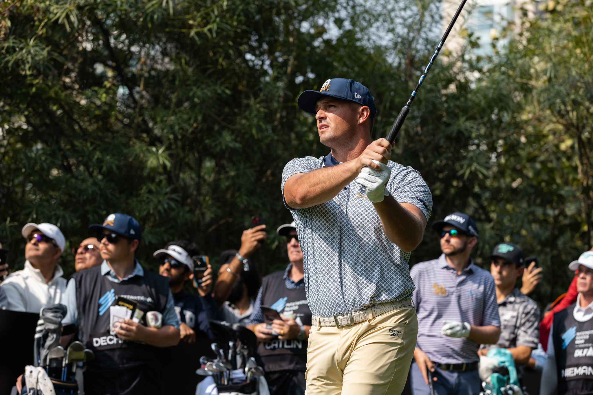 Bryson DeChambeau plays a tee shot at the International Series India