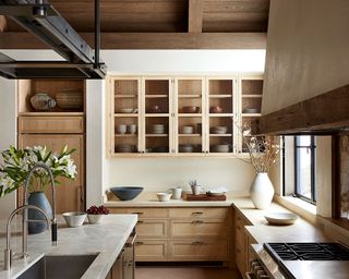 Kitchen with warm wood cabinets and cream walls