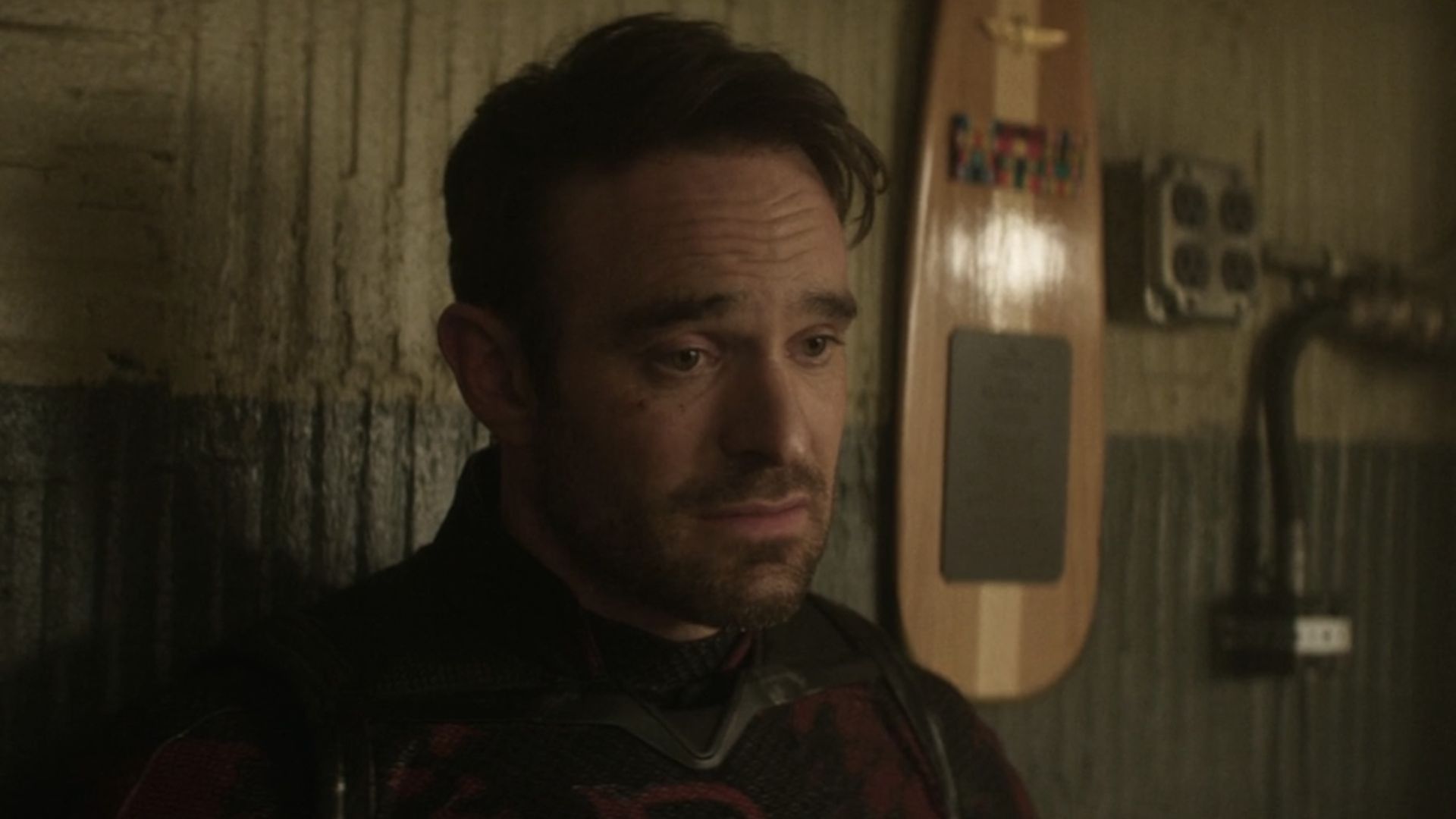 Charlie Cox's Matt Murdock in the daredevil suit with no mask looking upset in Born Again Season 2.