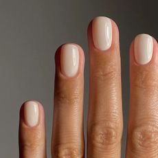 A close-up of a creamy linen nail look