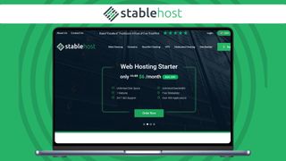 An image of the StableHost website home page on a laptop screen
