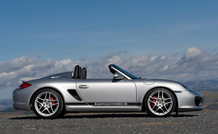 Silver sports car with the roof down