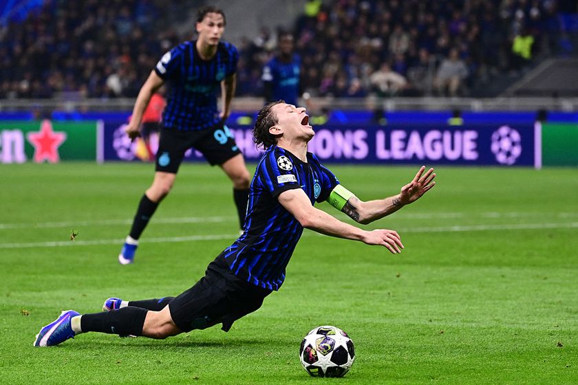 Inter Milan's Italian midfielder #23 Nicolo Barella falls after a tackle by Bodo/Glimt's Danish forward #09 Kasper Waarst Hogh (not in picture) during the UEFA Champions League second-leg play-off football match between Inter Milan and Bodo/Glimt at San Siro stadium in Milan, northern Italy, on February 24, 2026.