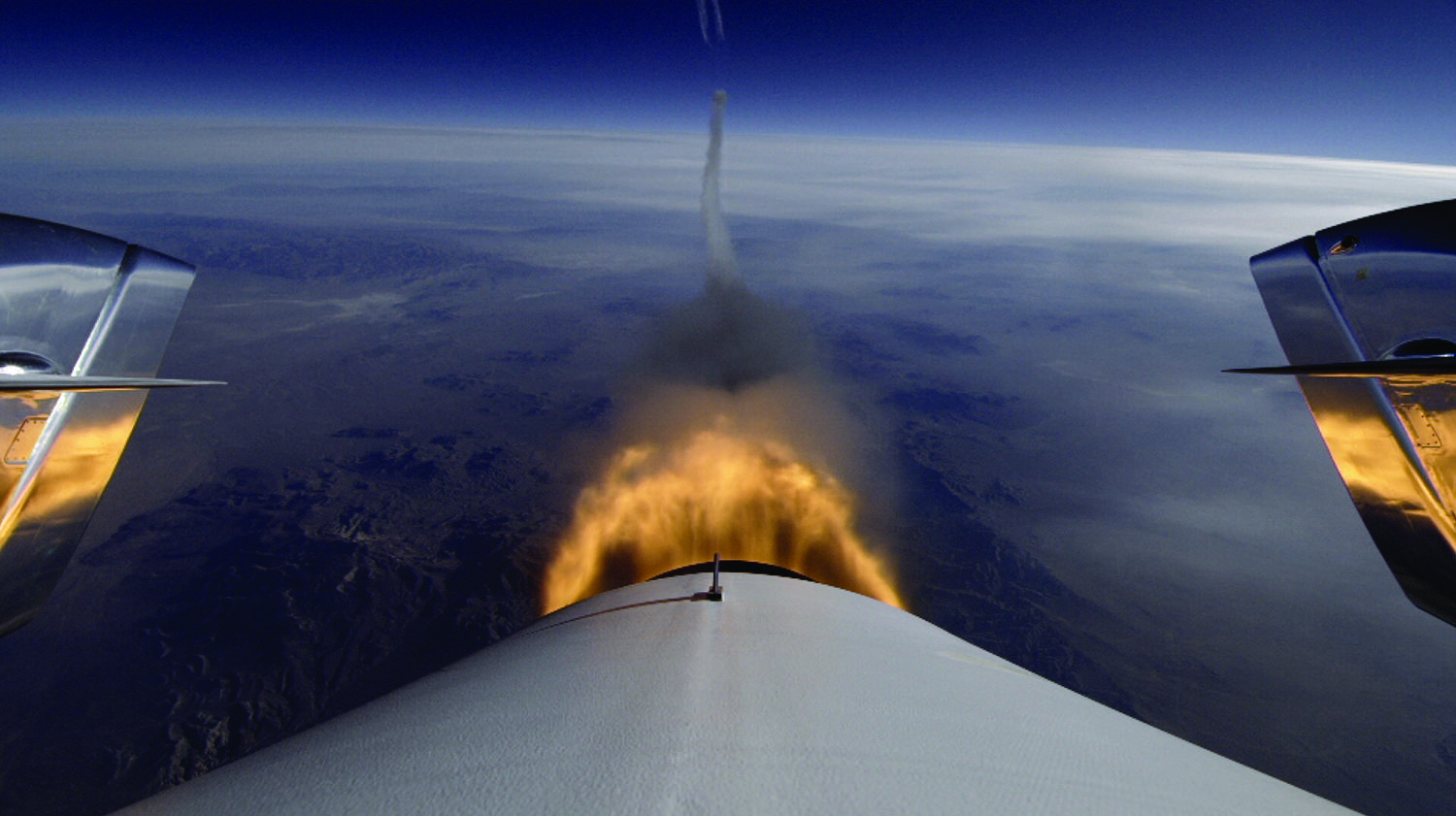 This photo of Virgin Galactic&#039;s SpaceShipTwo in flight shows the view aft as the private space plane made its third supersonic rocket-powered test flight on Jan. 10, 2014