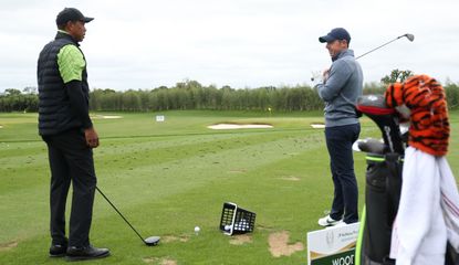 Tiger and Rory chat on the range