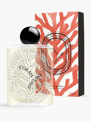 Diptyque Paris Corail Oscuro - Eau De Parfum beside its box on a white background